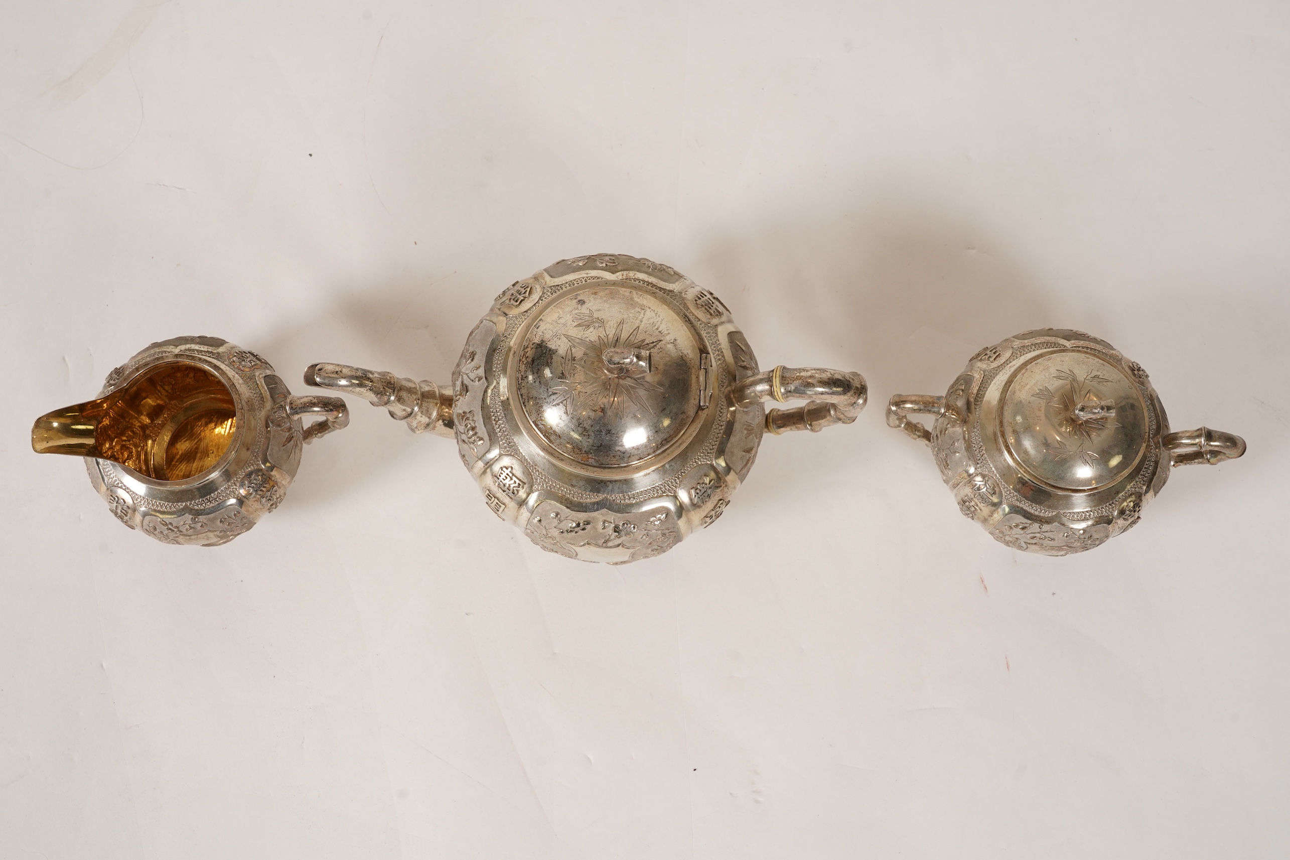 A late 19th/early 20th century Chinese Export white metal three-piece tea set, maker's mark WA